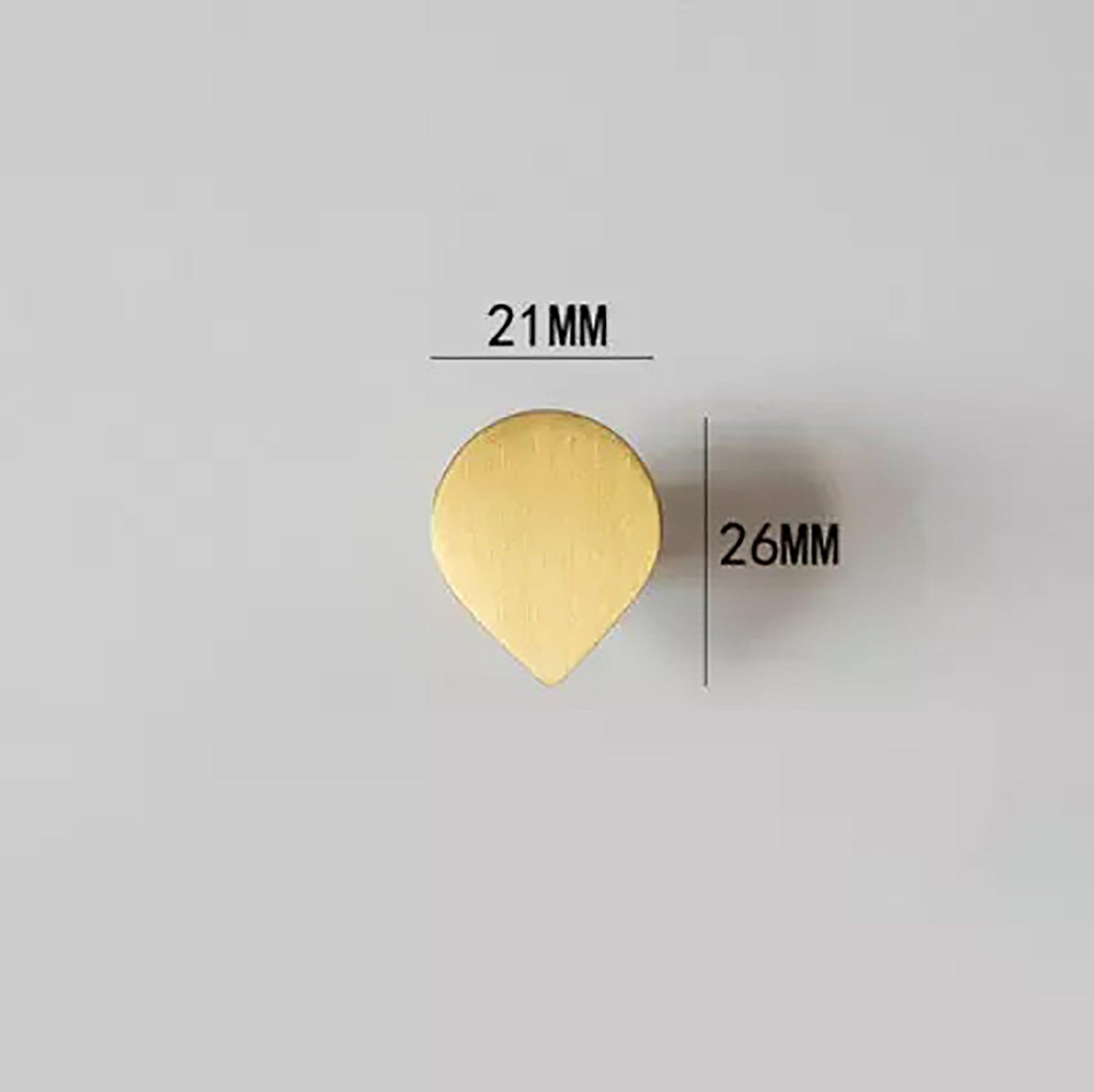 The Tarang Knob by Mantara (B-0104) is a brushed brass modern pair knob in gold, perfect for wardrobes, doors, and kitchens.