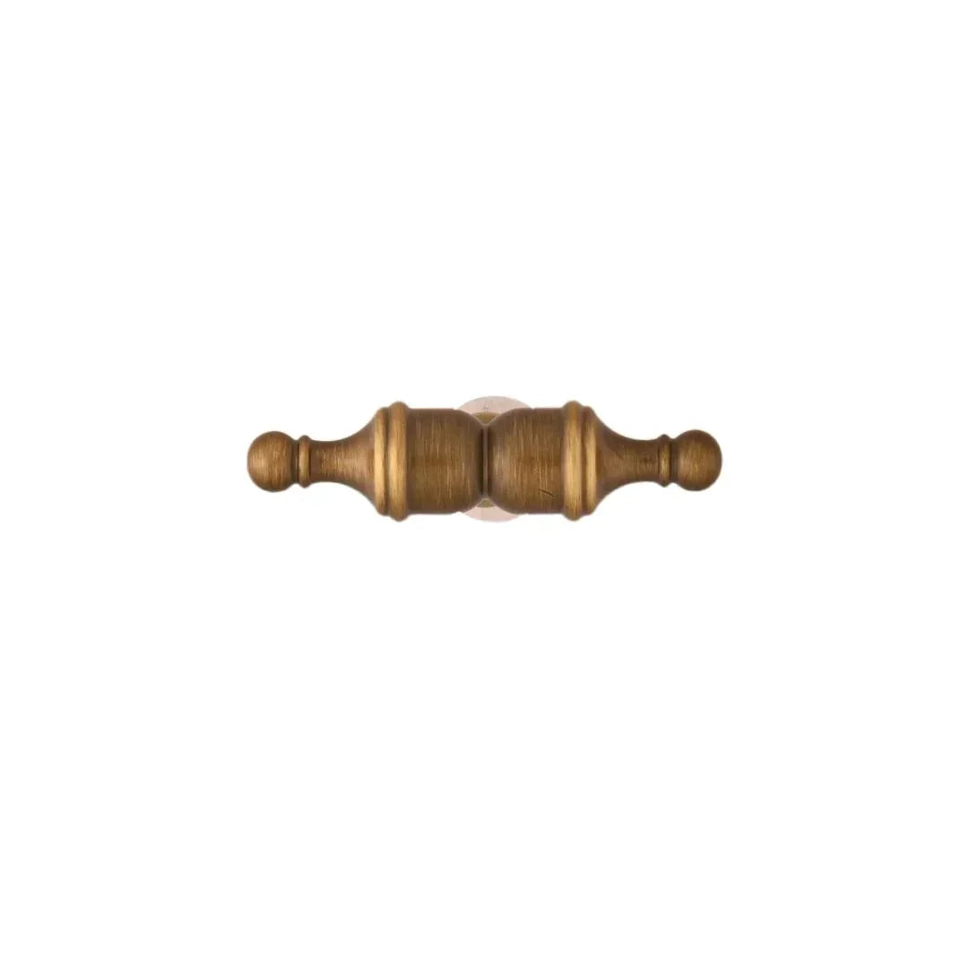 The Mantara B-0129 Thara Handle is a modern brass handle in bronze and gold, ideal for drawers, cabinets, and kitchen furniture.