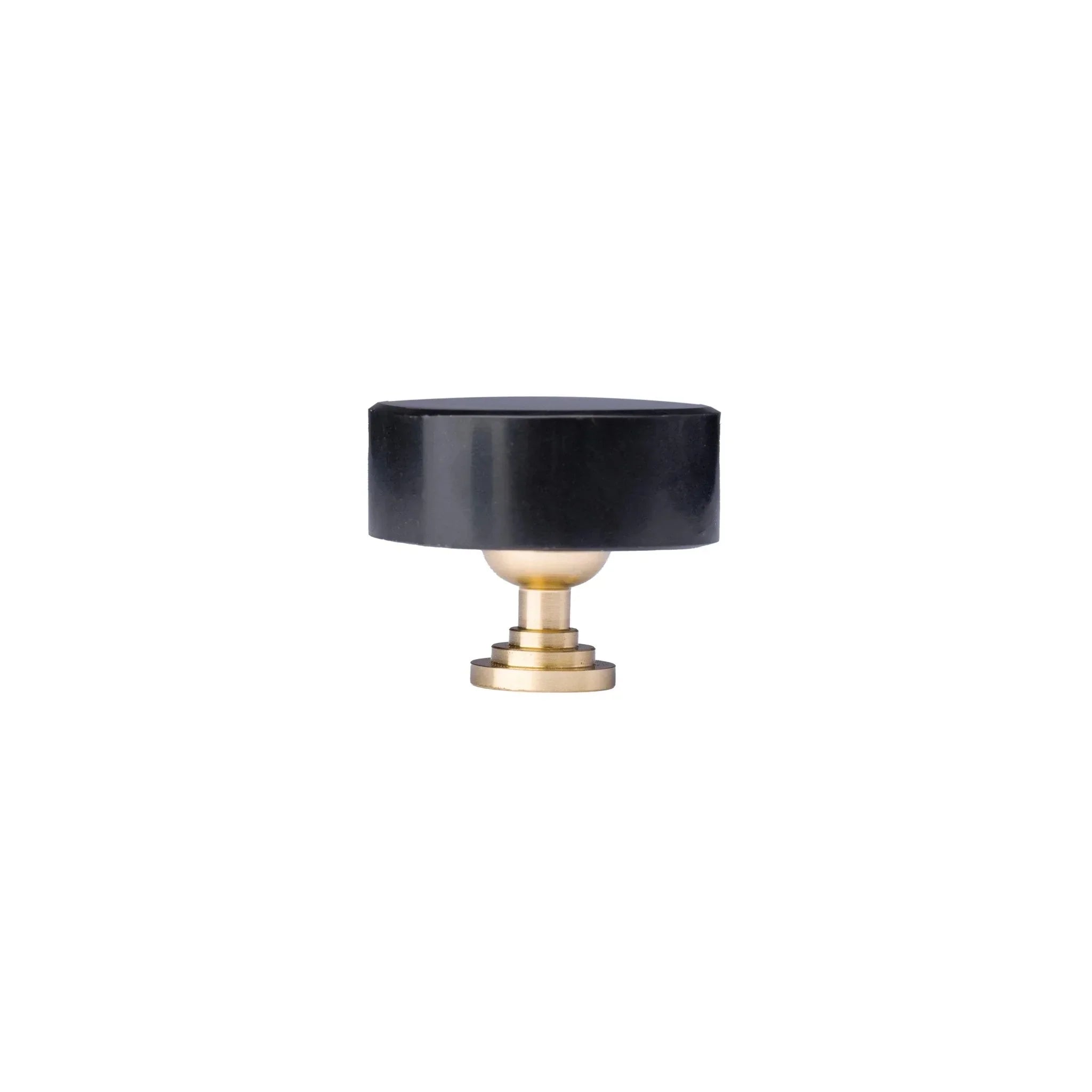 The Mantara M-0001 Theo Knob is a modern marble and brass knob in black, ideal for doors, drawers, and cabinets.