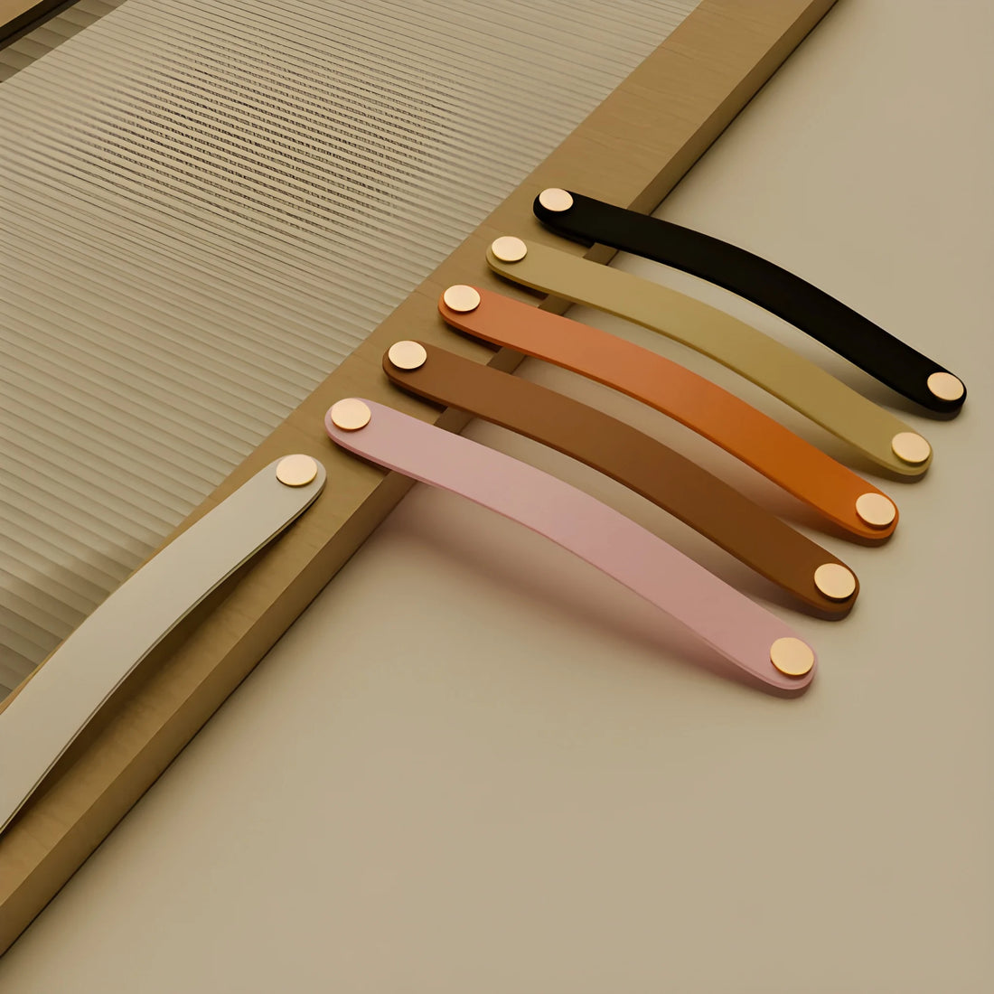 The Mantara L-0001-160 Maverick Handle is a Nordic leather and brass handle in pink,brown,black,orange ideal for kitchens and wardrobes.
