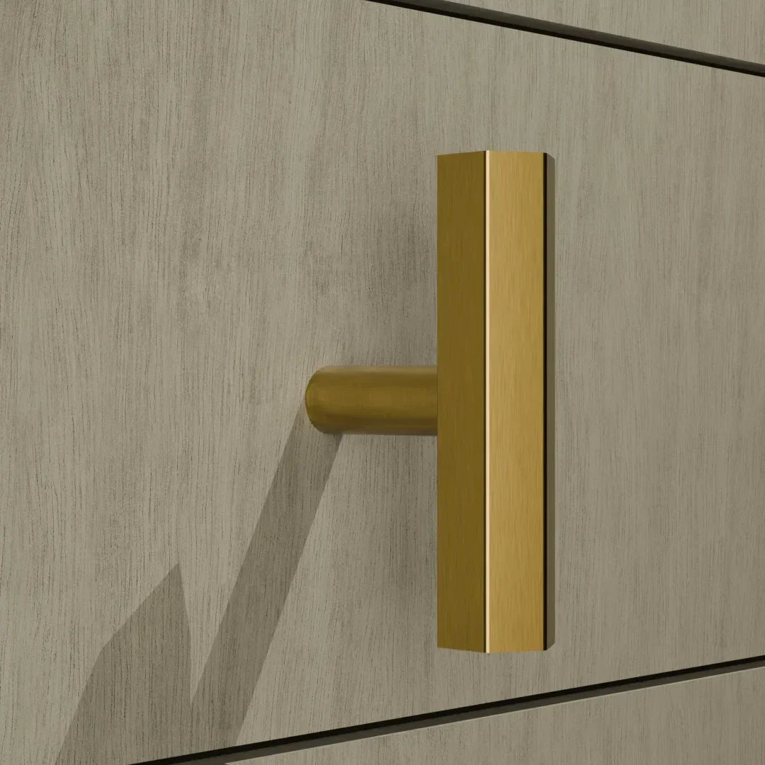 The Mantara B-0052 Oblivion T-Bar Handle is a modern solid brass handle in matte black, gold, and bronze, ideal for cabinets, kitchens, bedrooms, and drawers.