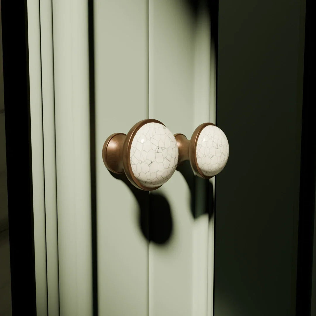 The Mantara CR-0007 Empire Knob is a traditional zinc and ceramic handle in white with a polished finish, ideal for wardrobes and cabinets.