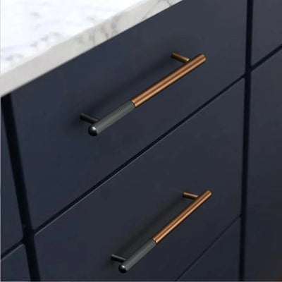 The Mantara AL-0003 Urbane Bar Handle is a modern aluminum alloy handle in brown and black, perfect for doors and wardrobes.