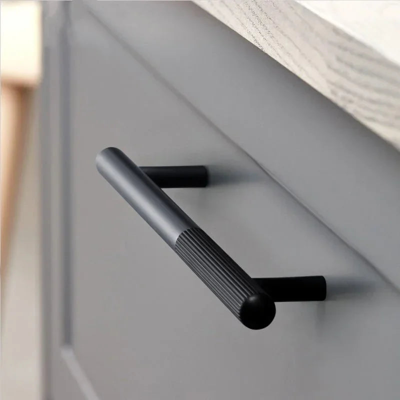 The Mantara AL-0003 Urbane Bar Handle is a modern aluminum alloy handle in black, perfect for doors and wardrobes.