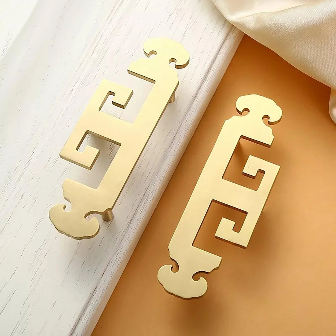 Mantara Yang Handle B-0083 is a modern brass handle in brushed gold, perfect for drawers, almirahs, and bedrooms.