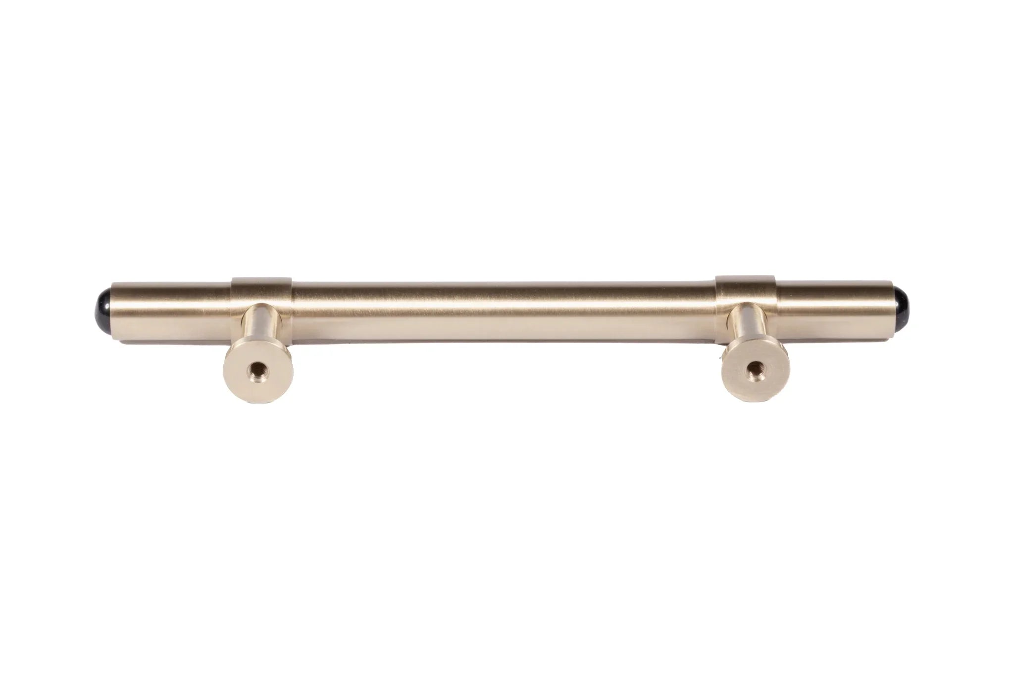The Zania Handle by Mantara B-0111 is a modern brushed brass handle in gold, ideal for kitchens, dressers, and cabinets.