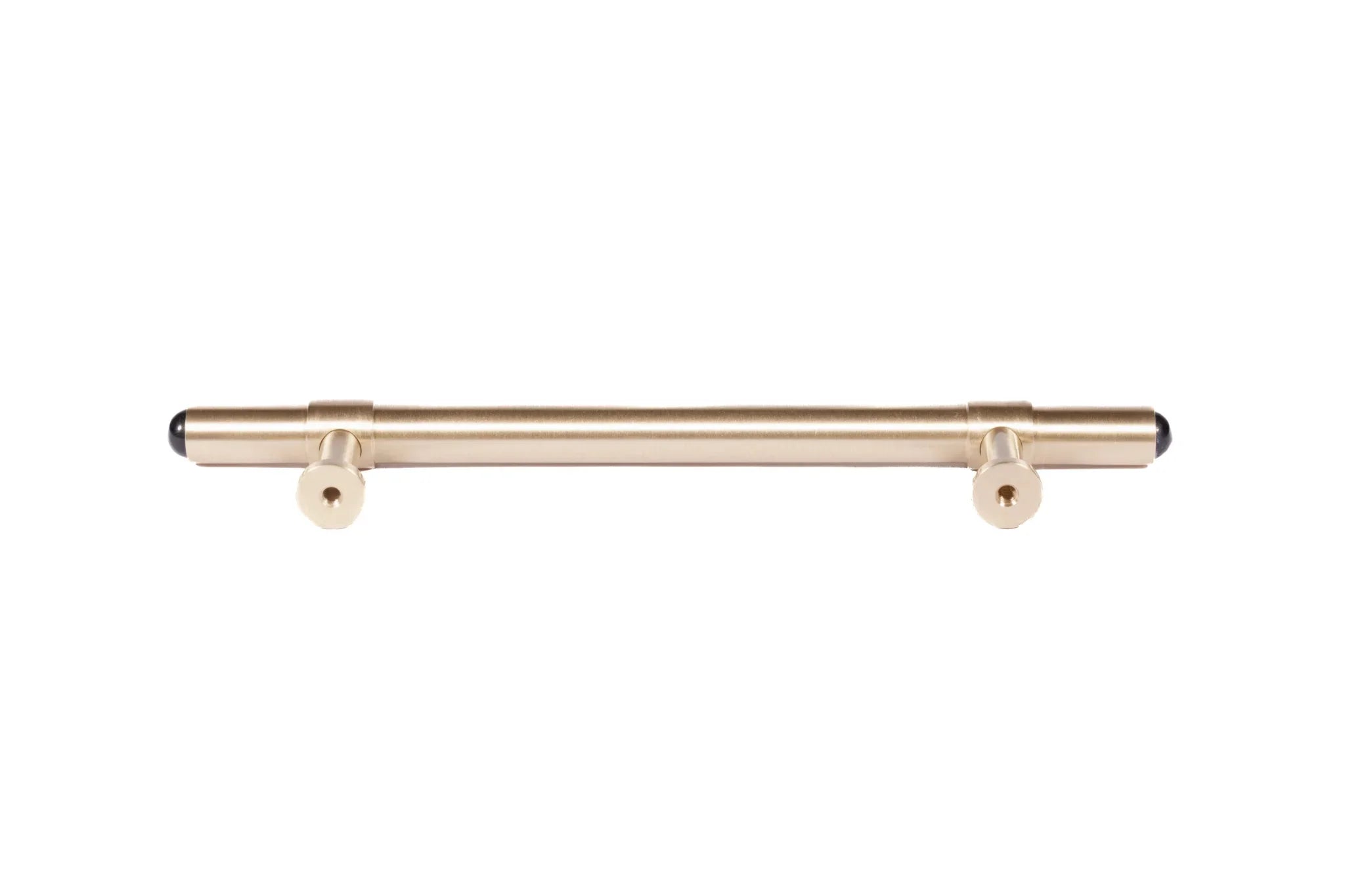 The Zania Handle by Mantara B-0111 is a modern brushed brass handle in gold, ideal for kitchens, dressers, and cabinets.