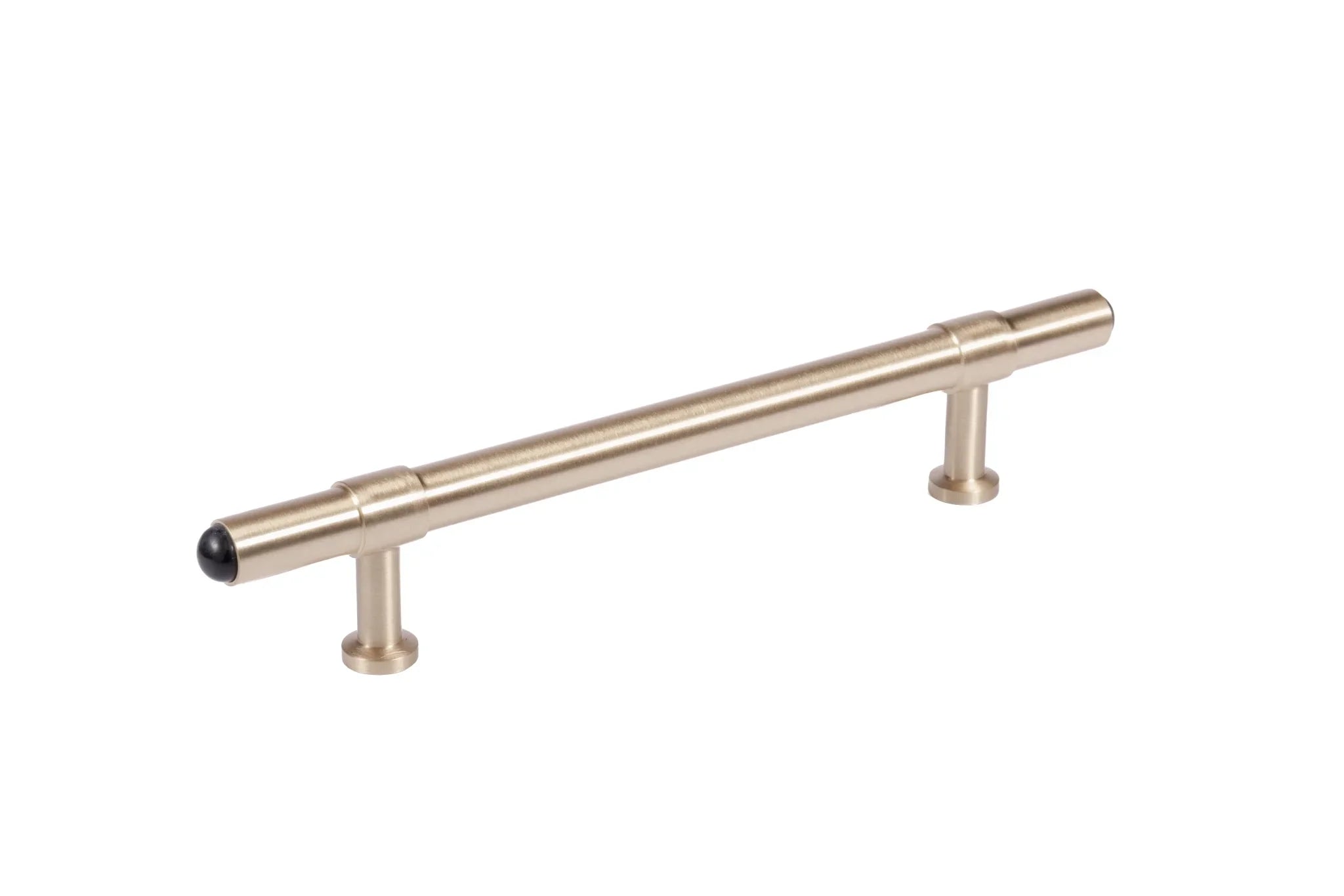 The Zania Handle by Mantara B-0111 is a modern brushed brass handle in gold, ideal for kitchens, dressers, and cabinets.
