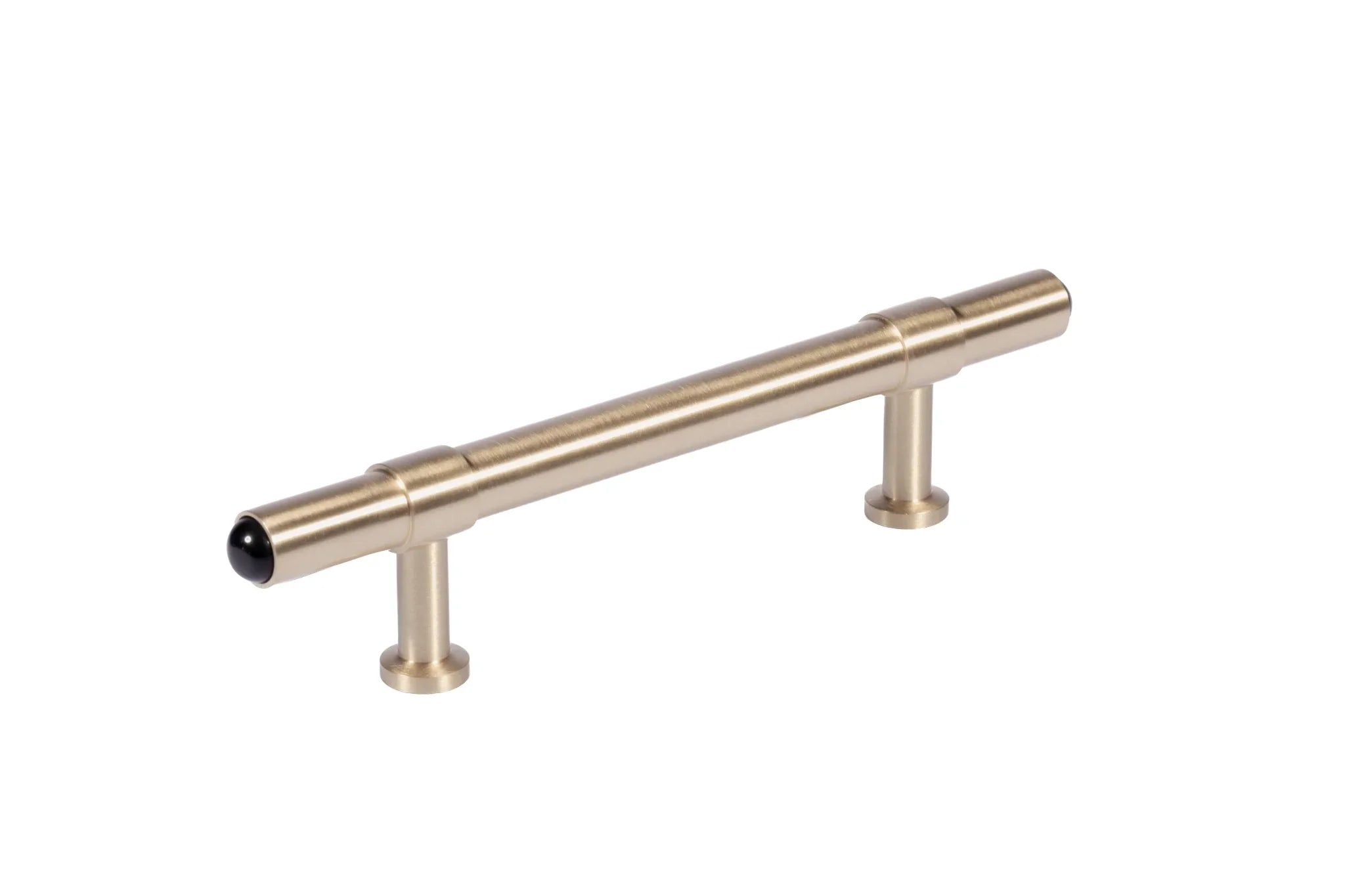 The Zania Handle by Mantara B-0111 is a modern brushed brass handle in gold, ideal for kitchens, dressers, and cabinets.