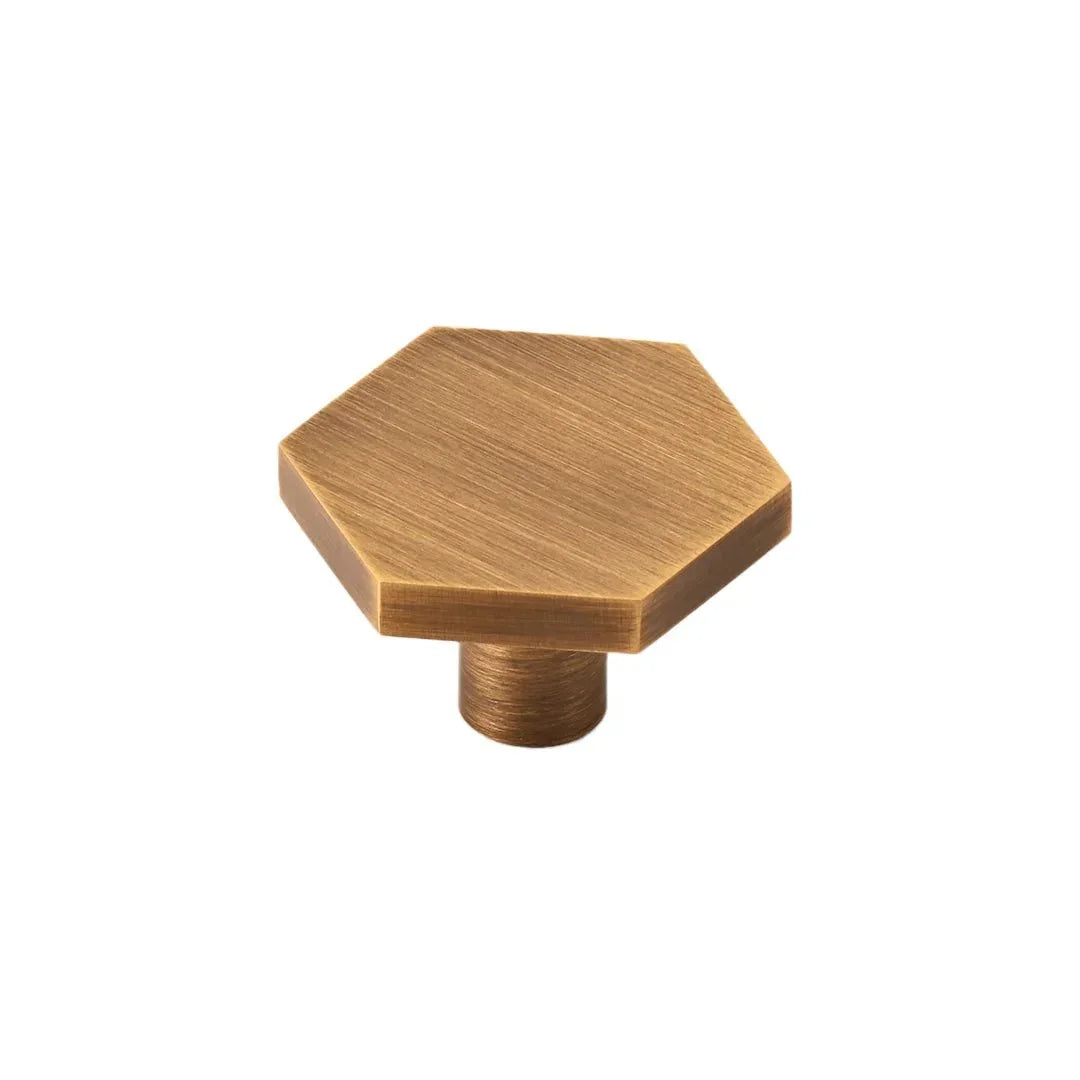 The Mantara B-0131 Zaraya Knob is a modern brass knob in gold, black, and bronze, perfect for drawers, cabinets, and wardrobes.