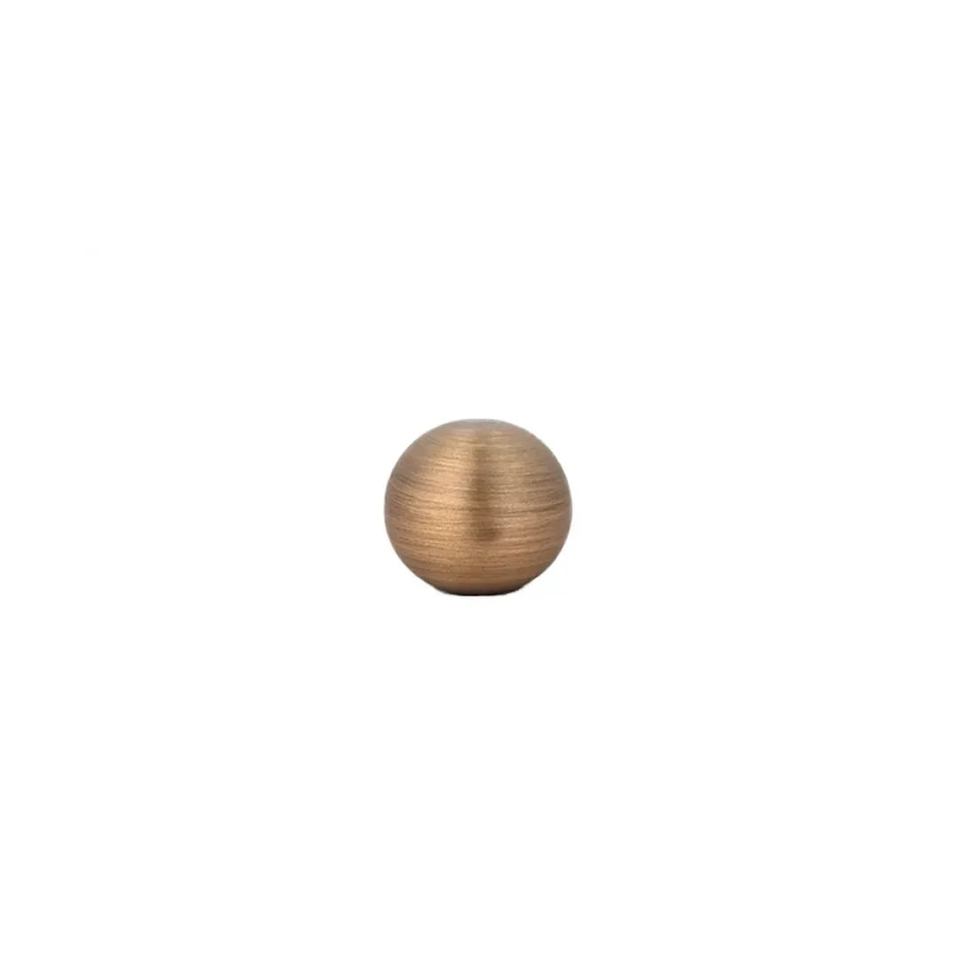 The Mantara B-0001 Zenith Knob is a modern brass knob in brushed bronze, perfect for wardrobes, cabinets, and drawers.