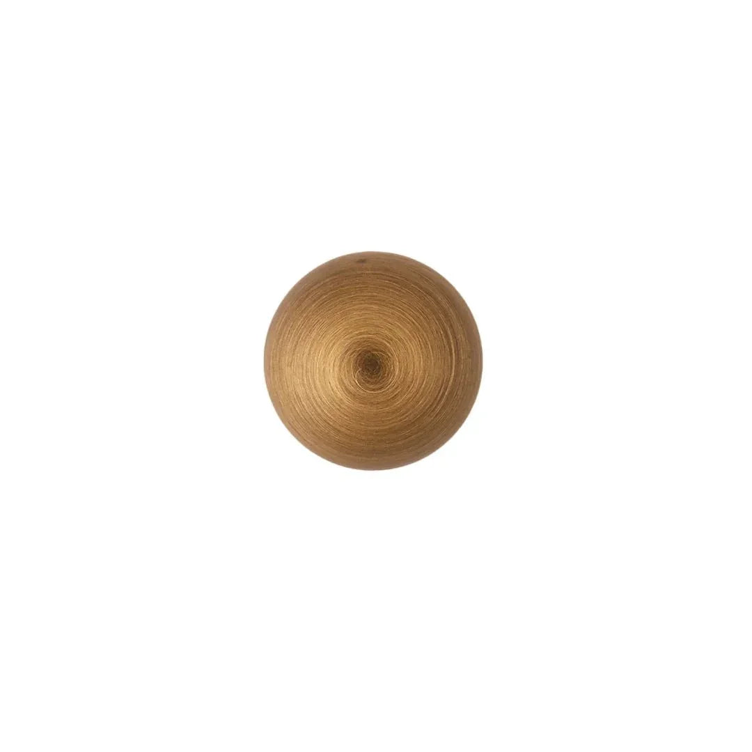 The Mantara B-0001 Zenith Knob is a modern brass knob in brushed bronze, perfect for wardrobes, cabinets, and drawers.