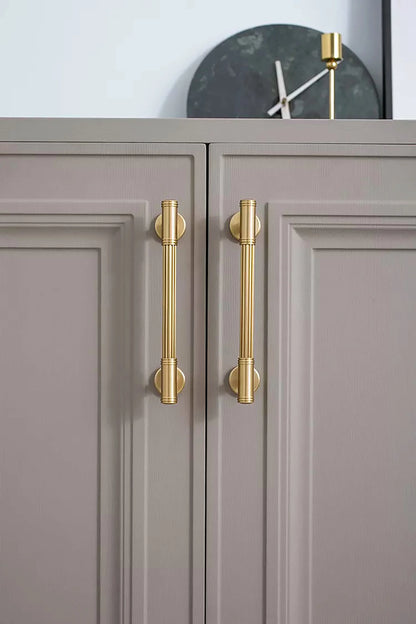 Mantara Olympus Handle B-0098 is a modern solid brass handle in brushed gold, perfect for wardrobes, kitchens, and cabinets.