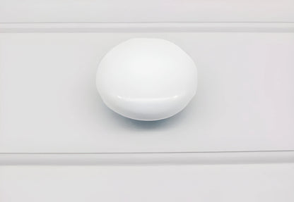 The Mantara CR-0005 Pebble Knob is a modern ceramic knob in white with a polished finish, ideal for wardrobes and drawers.