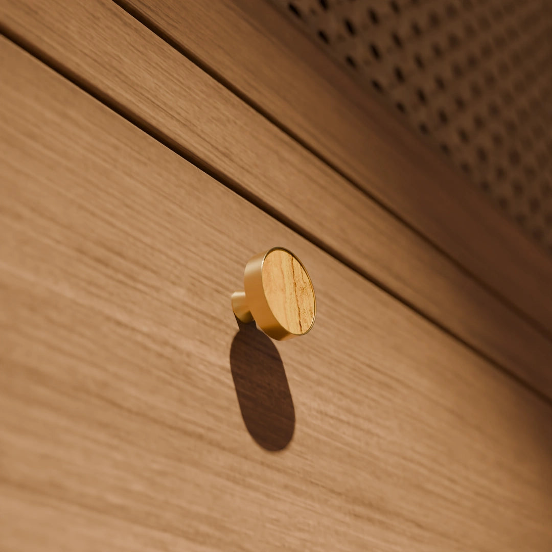 The Mantara M-0004 Carrara Knob is a modern stone and brass knob in Zebra stone, ideal for drawers and cabinets.