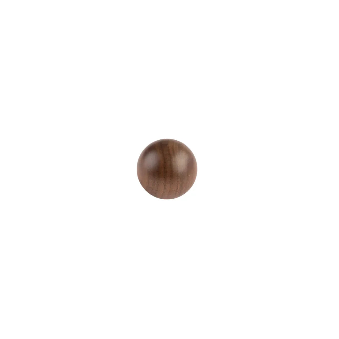 A single round wooden ball knob with a smooth, polished finish and visible wood grain, centered on a plain white background.