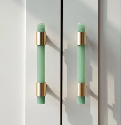 The Mantara C-0014-128 Luster Handle is a modern crystal and brass handle in green, ideal for wardrobes and doors.