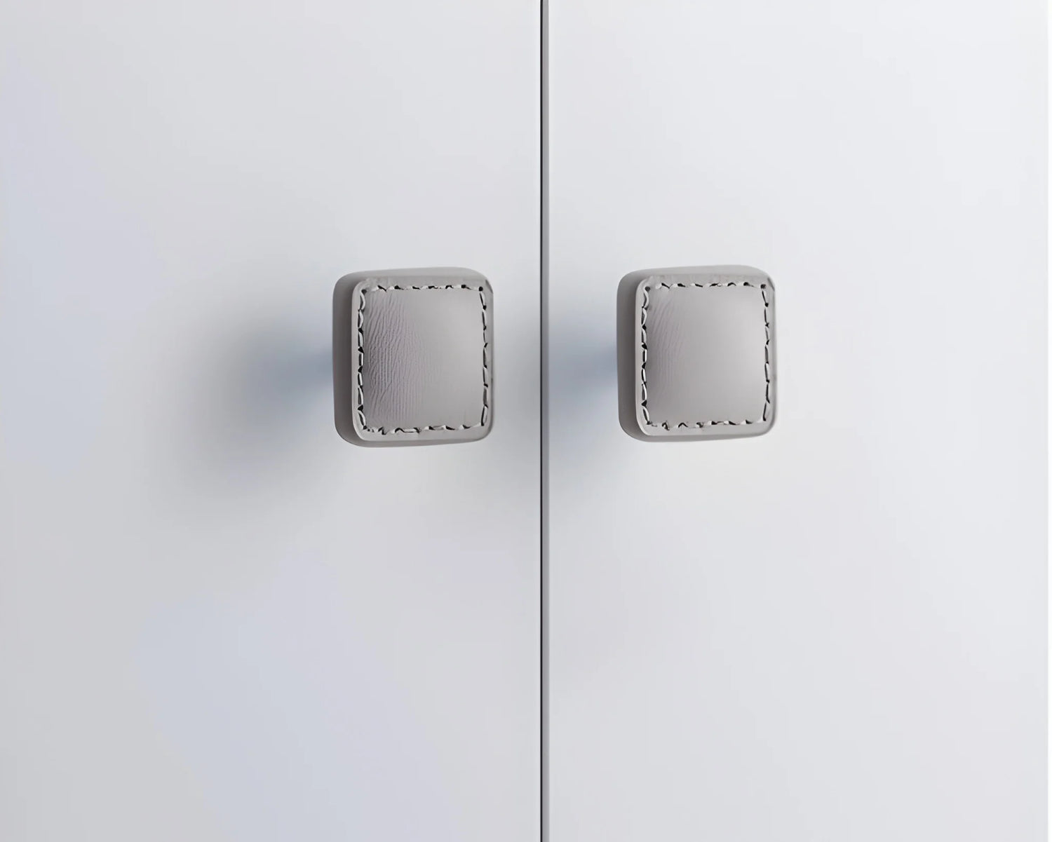 The Mantara L-0008 Sofia Square Knob is a modern leather knob in grey, perfect for cabinets and drawers.