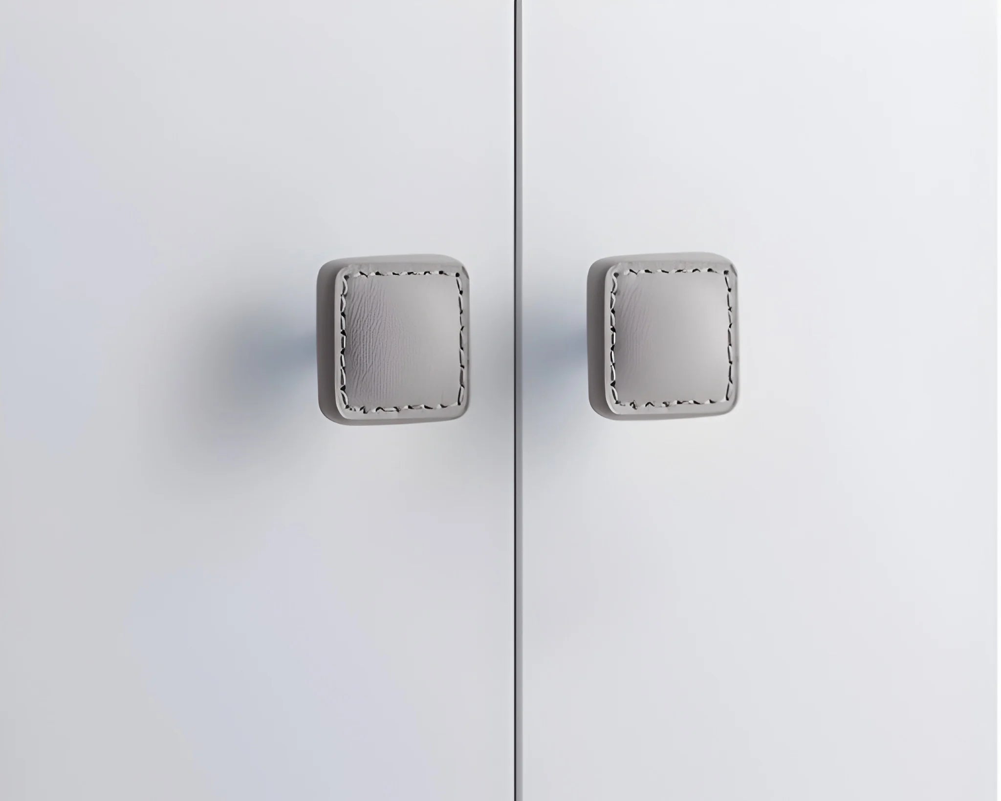 The Mantara L-0008 Sofia Square Knob is a modern leather knob in grey, perfect for cabinets and drawers.