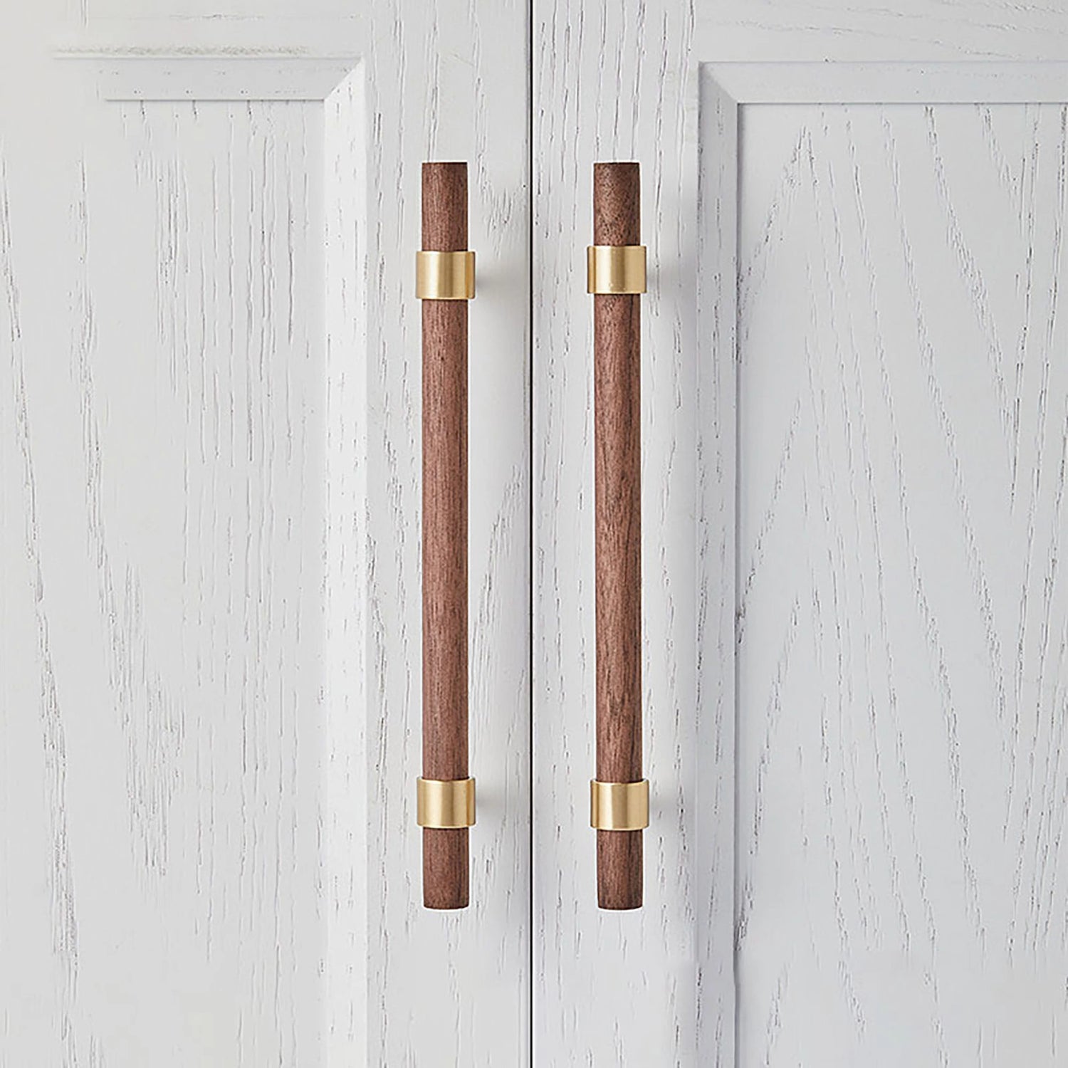 Mantara Holt Handle W-0010 is a modern walnut wood &amp; brass handle in dark brown with brushed finish, ideal for wardrobes &amp; drawers.