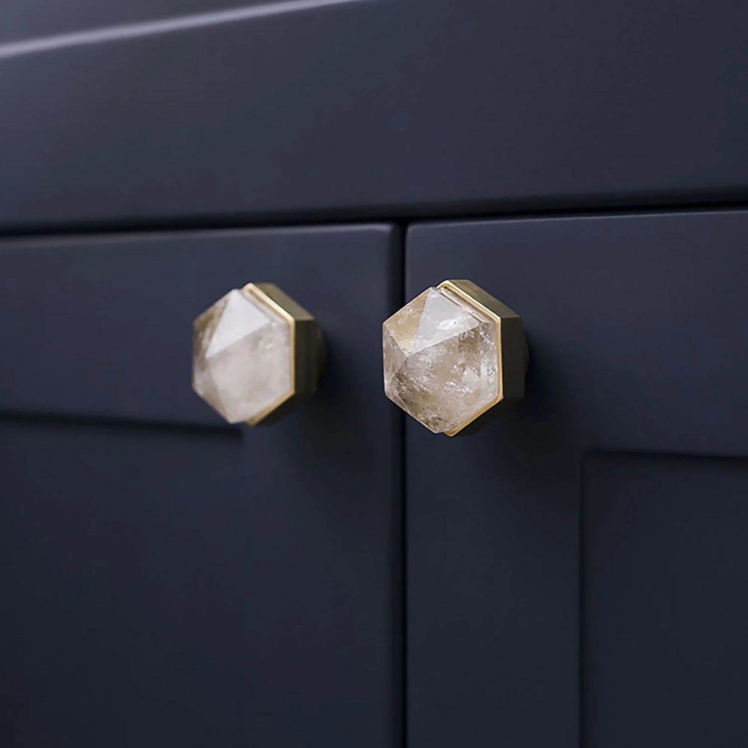 The Mantara C-0005 is a modern crystal + brass knob in white, ideal for cabinets and wardrobes.