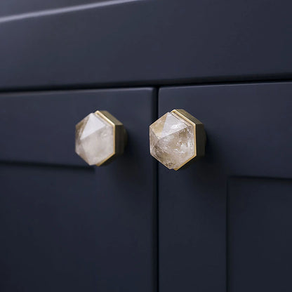 The Mantara C-0005 is a modern crystal + brass knob in white, ideal for cabinets and wardrobes.