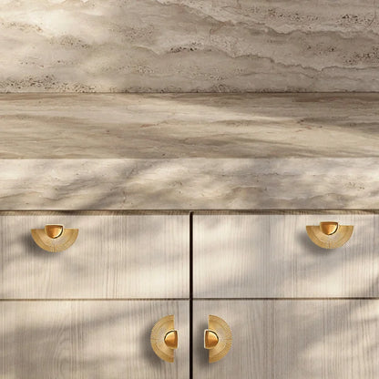 Mantara Palm Knob B-0085 is a modern polished brass knob in gold, perfect for doors, cabinets, and wardrobes.