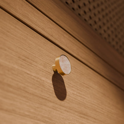 The Mantara M-0004 Carrara Knob is a modern stone and brass knob in  Red jade , ideal for drawers and cabinets.