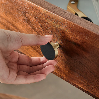 The Mantara L-0004 Obsidian Knob is a modern brass and leather knob in black, perfect for wardrobes, kitchens, and cabinets.