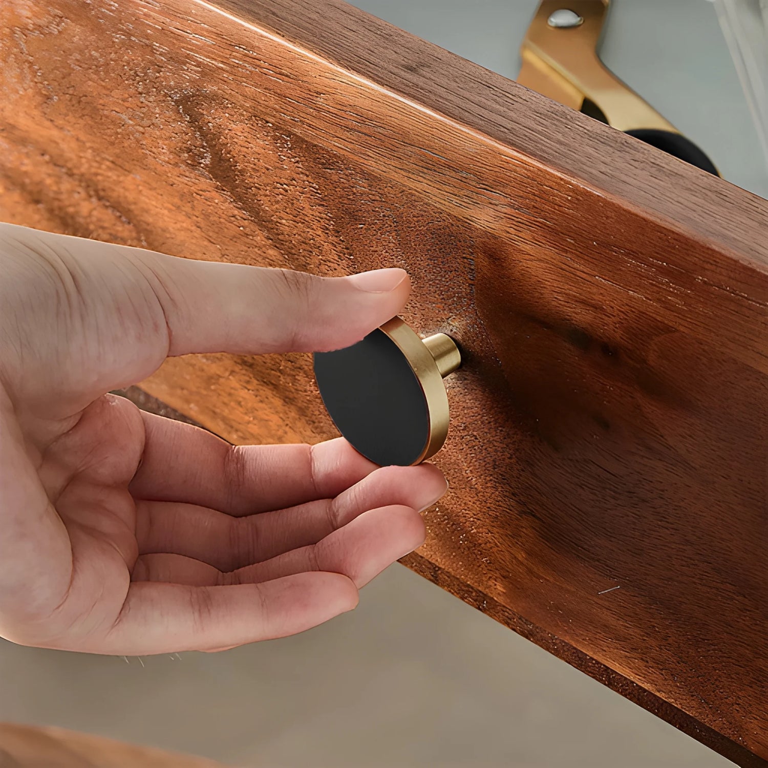 The Mantara L-0004 Obsidian Knob is a modern brass and leather knob in black, perfect for wardrobes, kitchens, and cabinets.