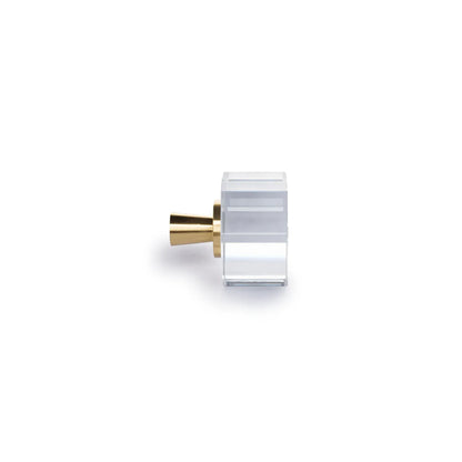 A modern cylindrical cabinet knob with a clear acrylic or glass body and a brushed gold metal base, shown on a plain white background.