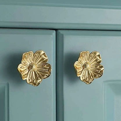 The Mantara B-0018 Flora Knob is a modern polished brass knob in gold, perfect for furniture, drawers, cabinets, and kitchens.