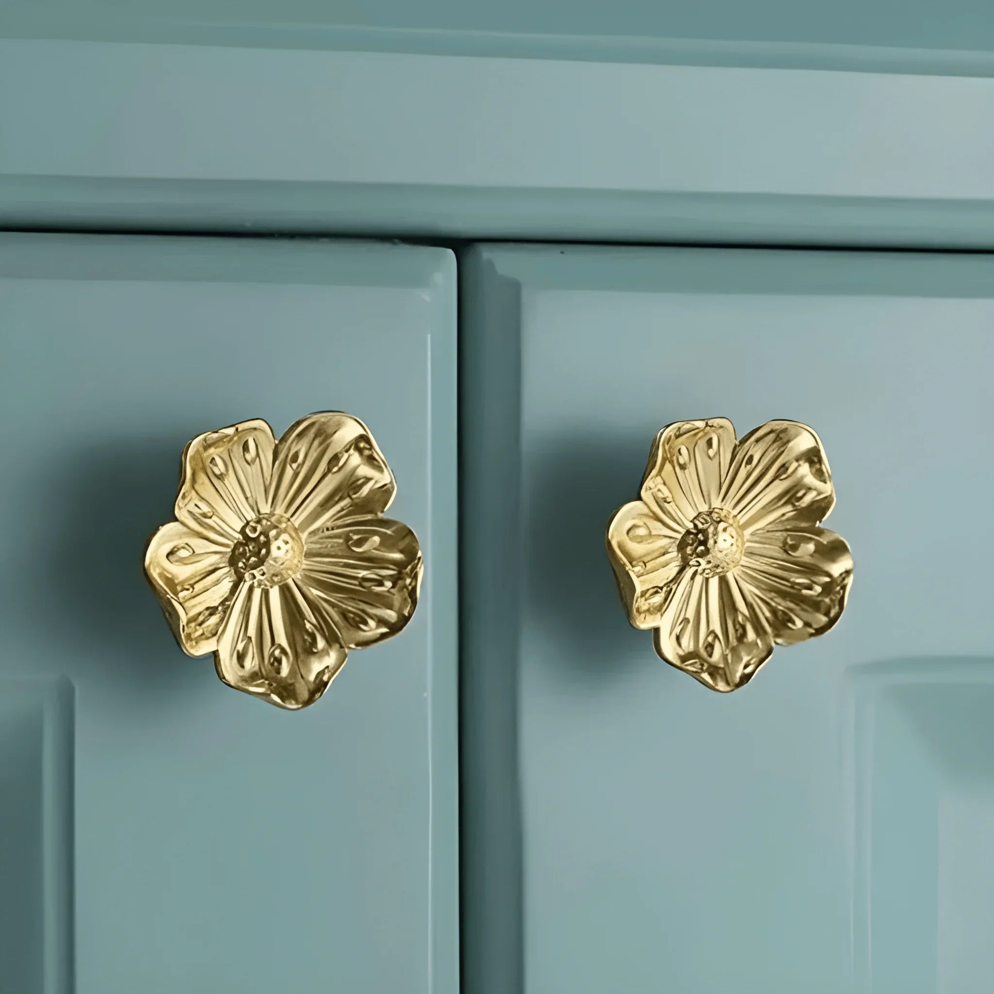 The Mantara B-0018 Flora Knob is a modern polished brass knob in gold, perfect for furniture, drawers, cabinets, and kitchens.
