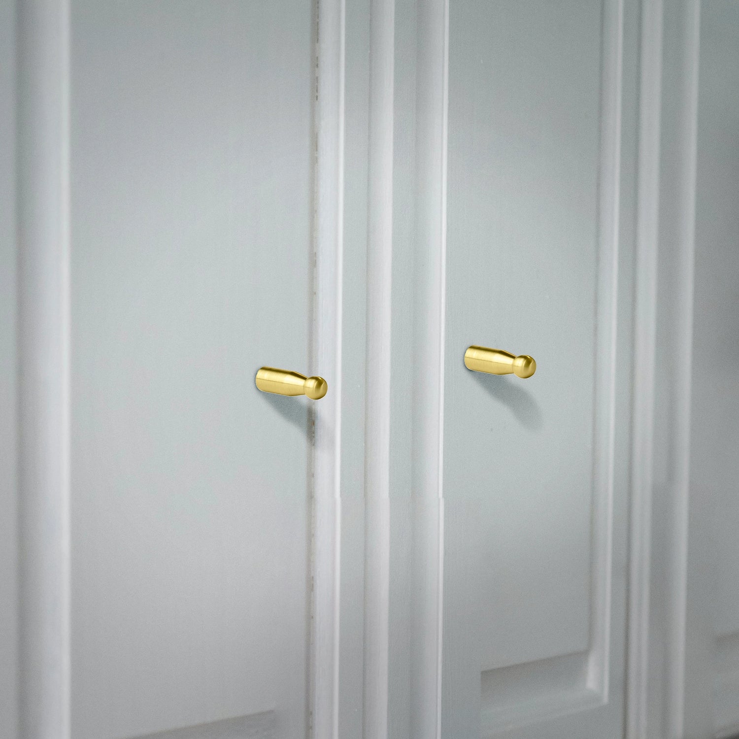 Mantara Aster Hook B-0093 is a modern brushed brass wall hook in gold, ideal for bathrooms, bedrooms, and living spaces.