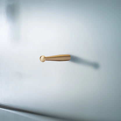 Mantara Mateo Hook B-0095 is a modern brushed brass wall hook in gold, ideal for bathrooms, bedrooms, hotels, and living rooms.