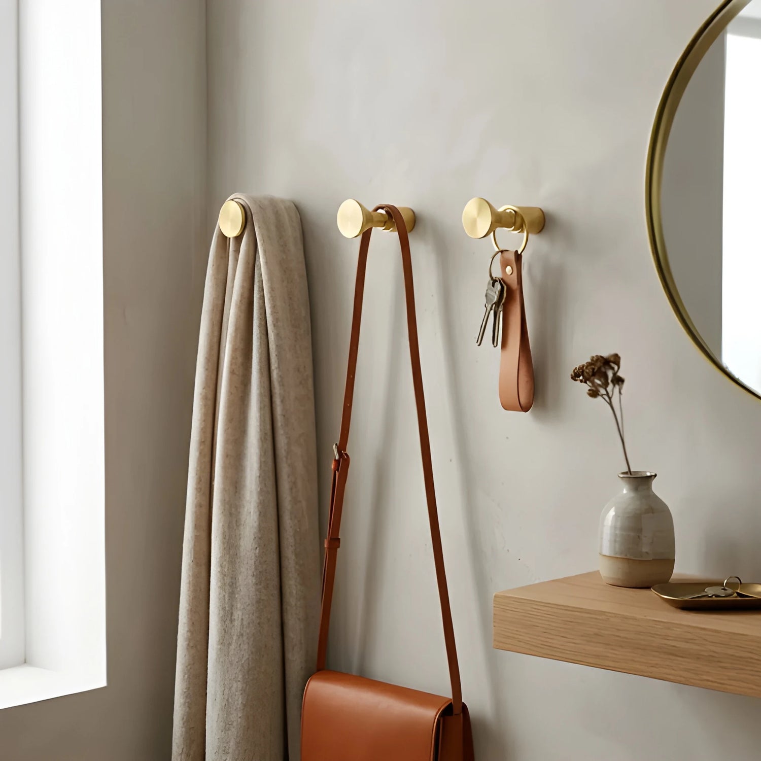 Mantara Tatiana Hook B-0097 is a modern brushed brass wall hook in gold, ideal for bathrooms, bedrooms, and living spaces.