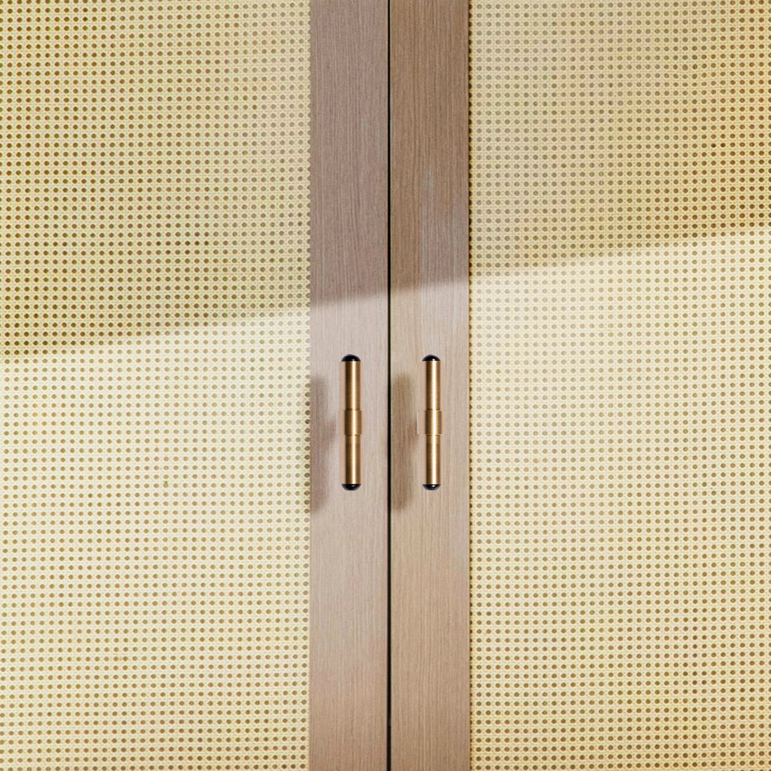 The Zania Handle by Mantara B-0111 is a modern brushed brass handle in gold, ideal for kitchens, dressers, and cabinets.