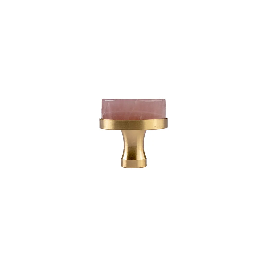 Pink round knob  on a white background