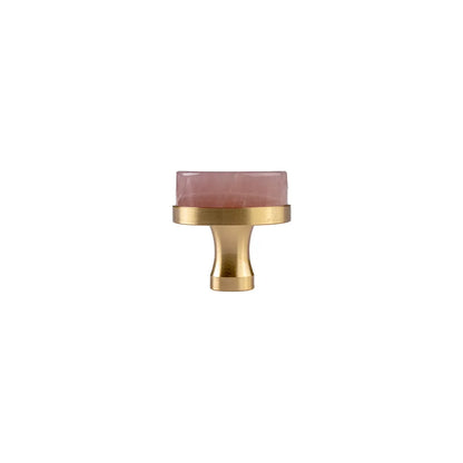 Pink round knob  on a white background