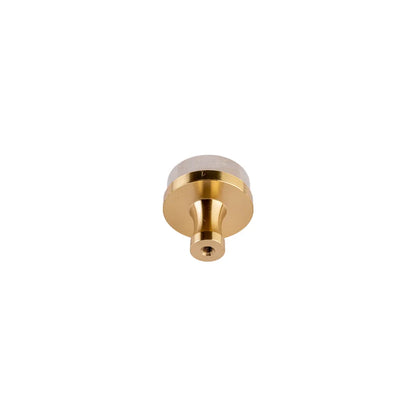 Brass with crystal white round knob placed backside of the product and shown on the white background