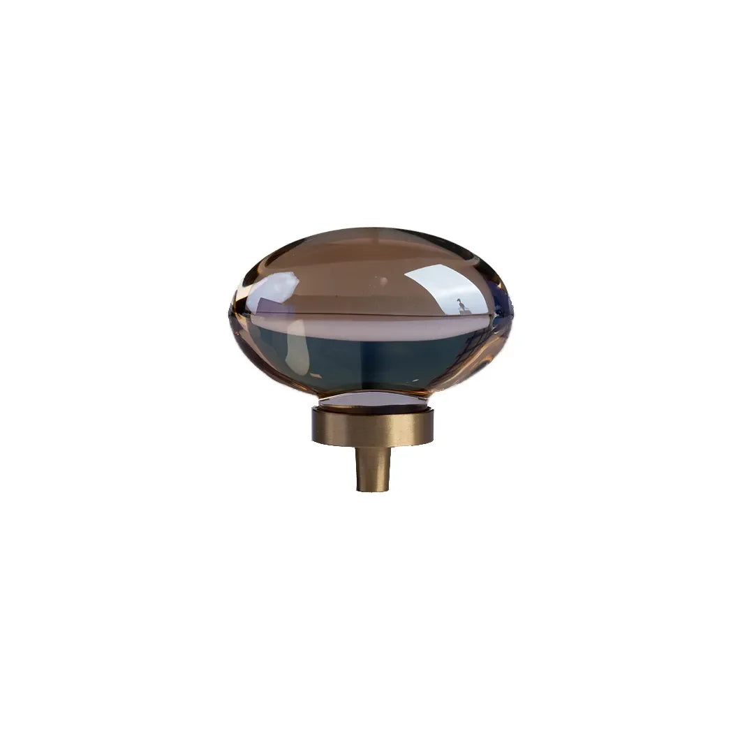 The Mantara C-0008 is a modern artificial crystal + brass knob in champange/brass, ideal for wardrobes and drawers.