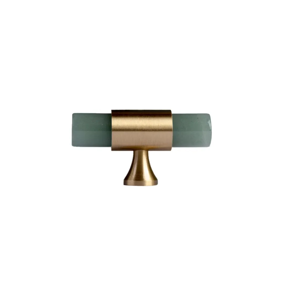 The Mantara C-0014-T Haze Handle is a modern crystal and brass T-handle in green, ideal for wardrobes and drawers.
