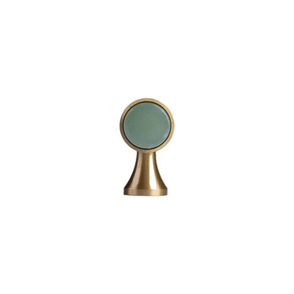 The Mantara C-0014-T Haze Handle is a modern crystal and brass T-handle in green, ideal for wardrobes and drawers.