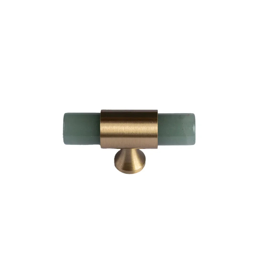 The Mantara C-0014-T Haze Handle is a modern crystal and brass T-handle in green, ideal for wardrobes and drawers.
