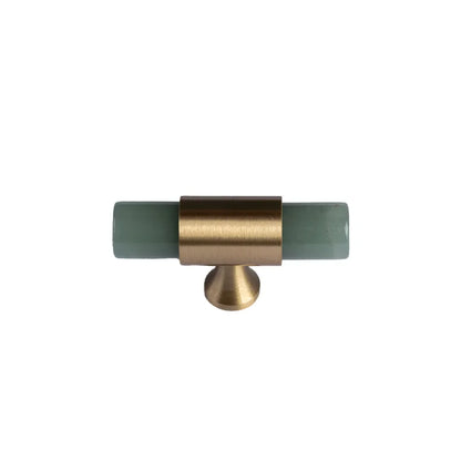 The Mantara C-0014-T Haze Handle is a modern crystal and brass T-handle in green, ideal for wardrobes and drawers.