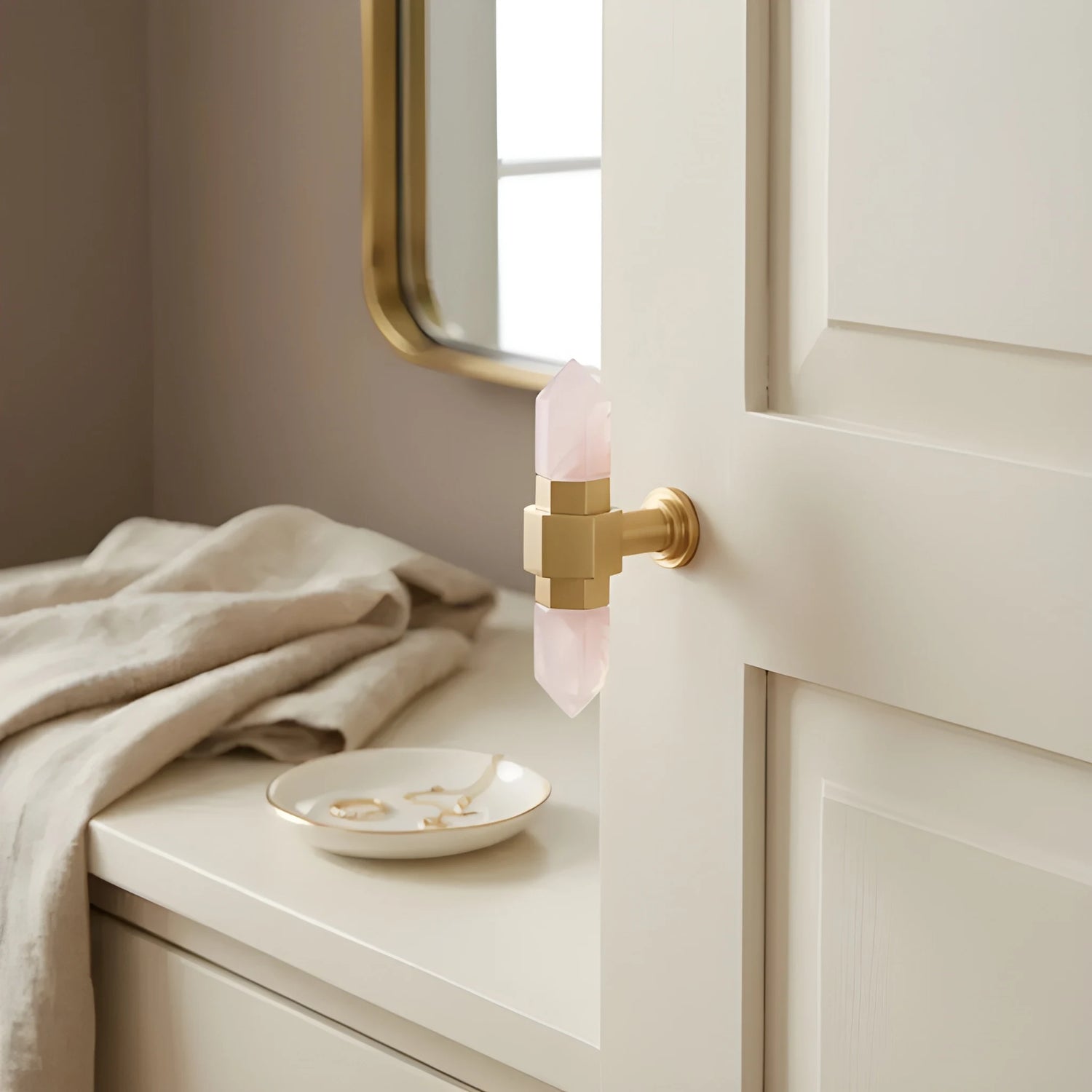 The Mantara C-0015 Quartz Handle is a modern brass and crystal handle in pink, ideal for doors, wardrobes, and cabinets.