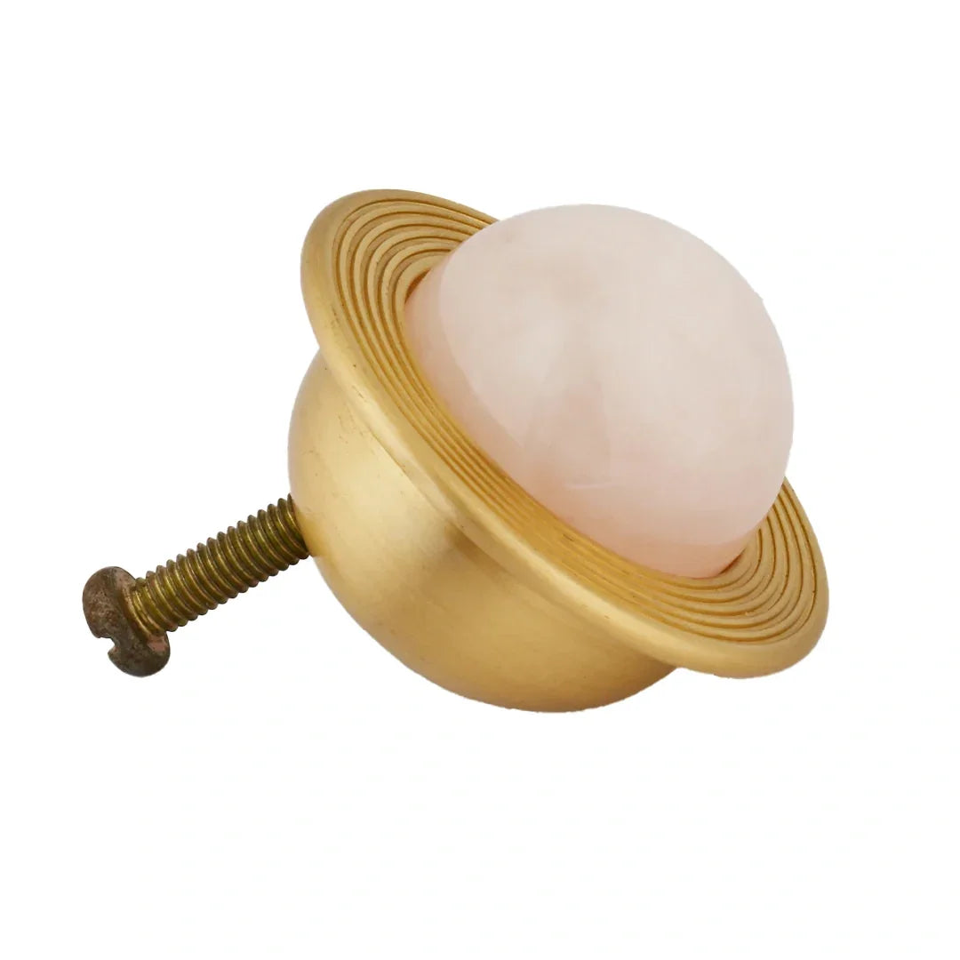 The Mantara C-0017 Opalia Knob is a modern crystal and brass knob pink, ideal for drawers and cabinets.