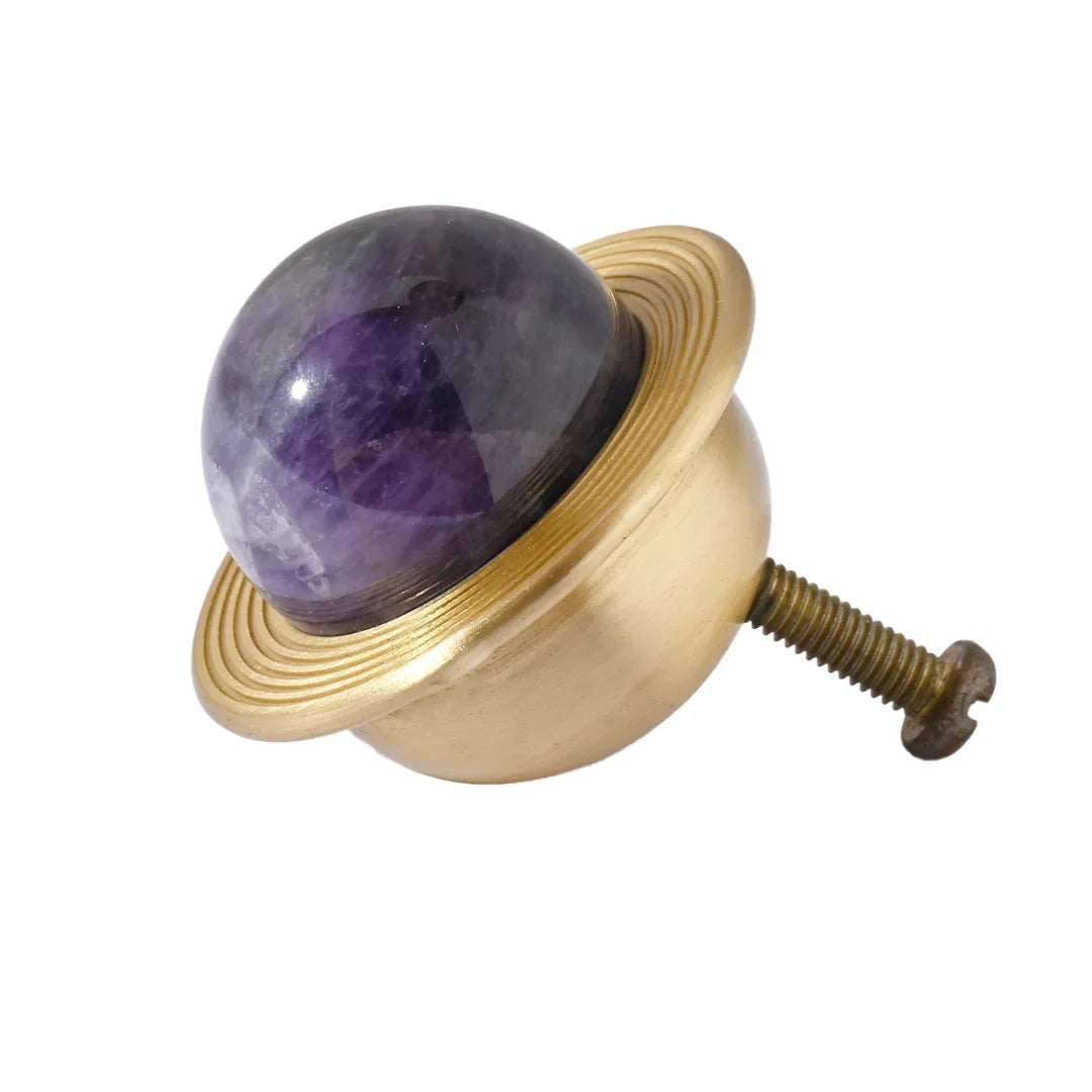 The Mantara C-0017 Opalia Knob is a modern crystal and brass knob purple, ideal for drawers and cabinets.