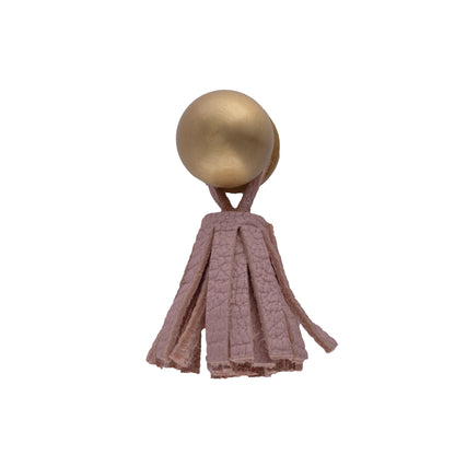 The Mantara L-0002 Maverick Drop Knob is a modern leather and brass knob in pink, ideal for kitchens and furniture.
