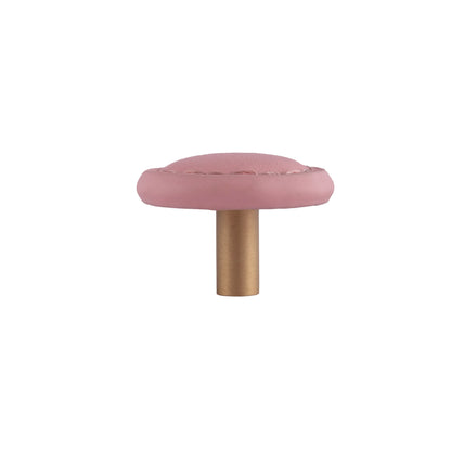 The Mantara L-0008 Sofia Round Knob is a modern leather knob in pink, ideal for cabinets and wardrobes.